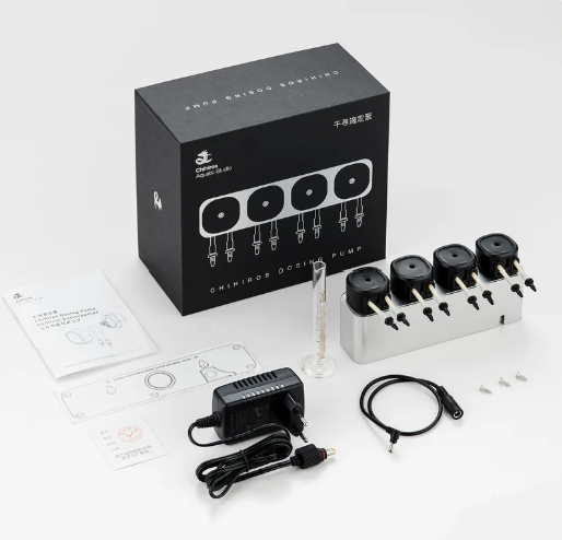 Chihiros 4-Channel Dosing Pump unboxed with retail box, pump unit, measuring cylinder, power adapter, cable, mounting screws, and instruction manual